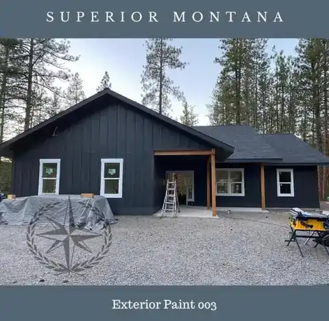 Board-and-batten exterior finished in its new dark paint, Superior, Montana