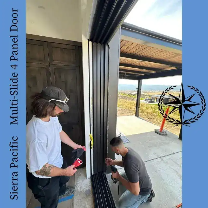Two of the crew setting the Sierra Pacific four-panel slider into its opening