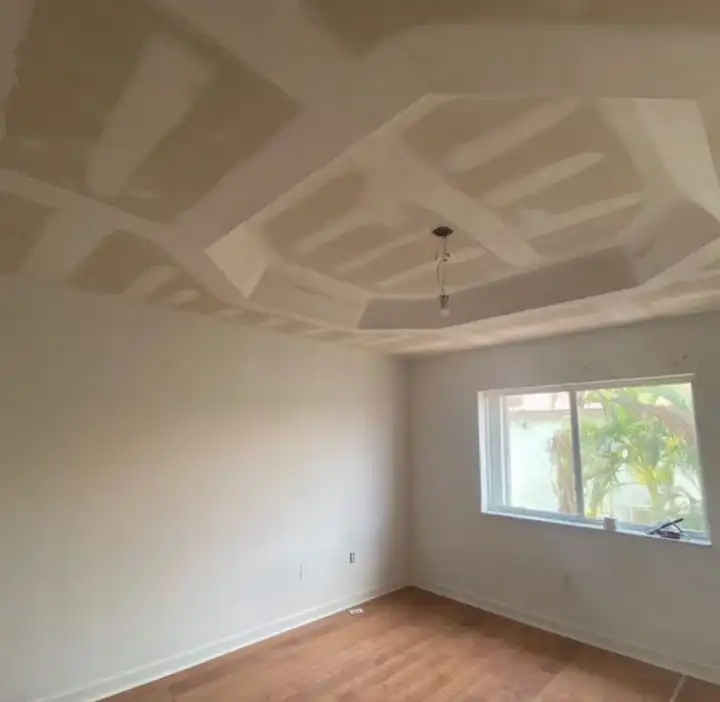 A finished room, drywall taped and primed