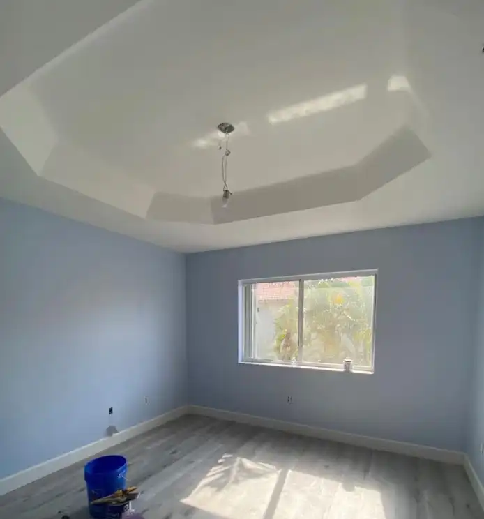 A finished tray ceiling in fresh drywall