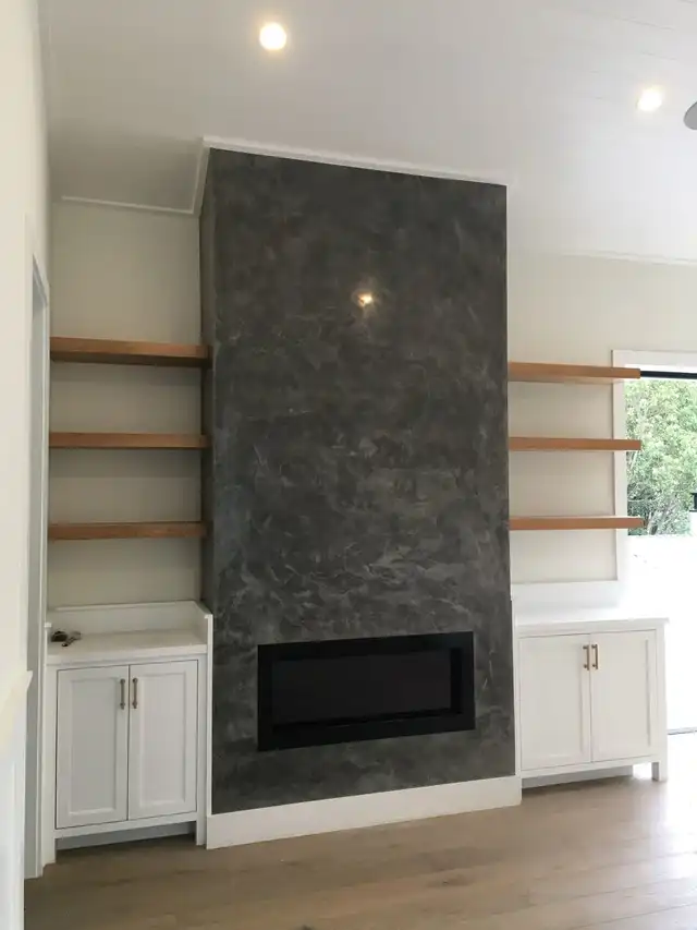 Venetian plaster fireplace wall in charcoal
