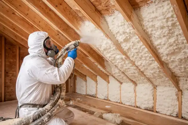 Spray foam insulation going into a roof
